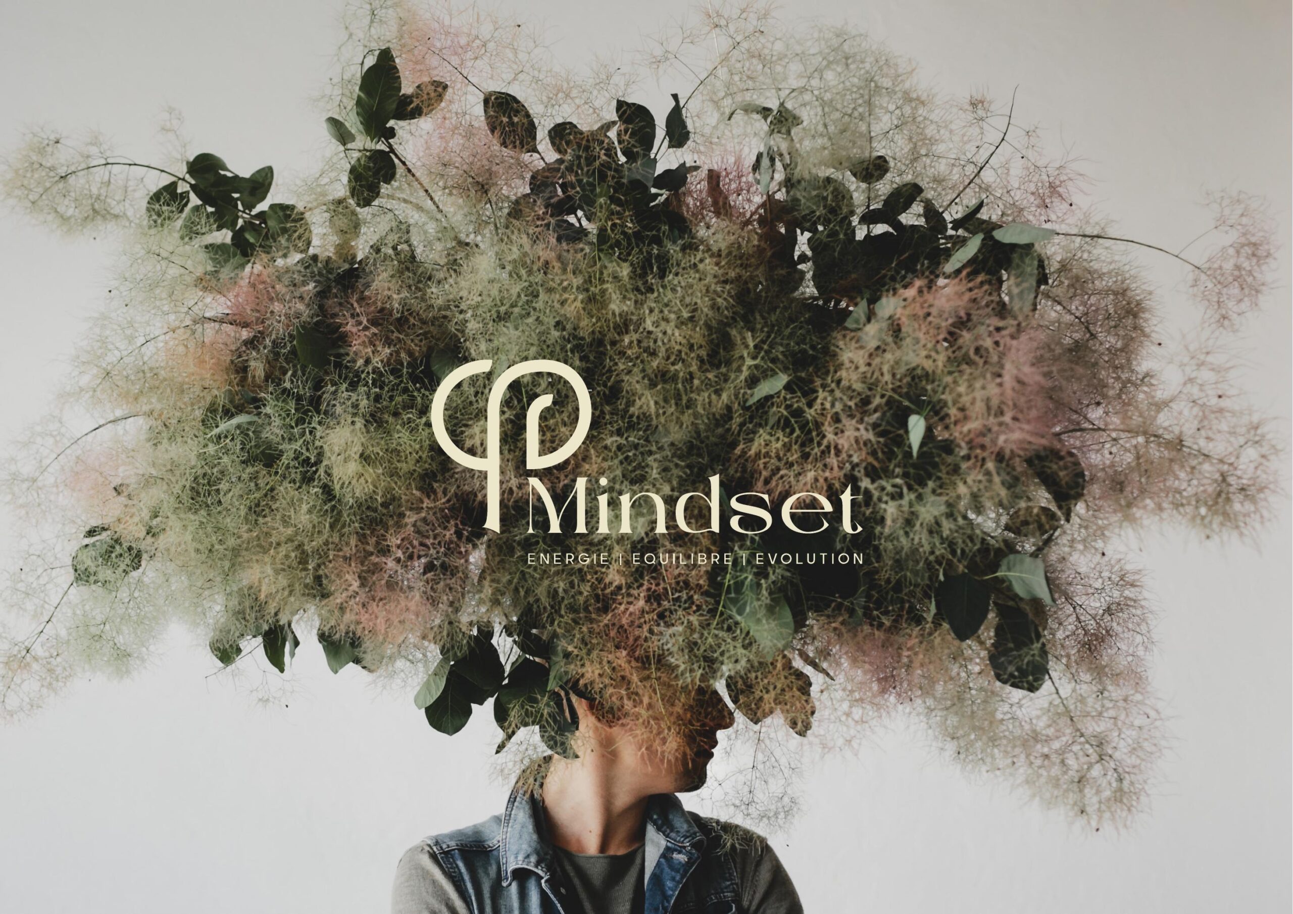 a woman in a black suit holding her head